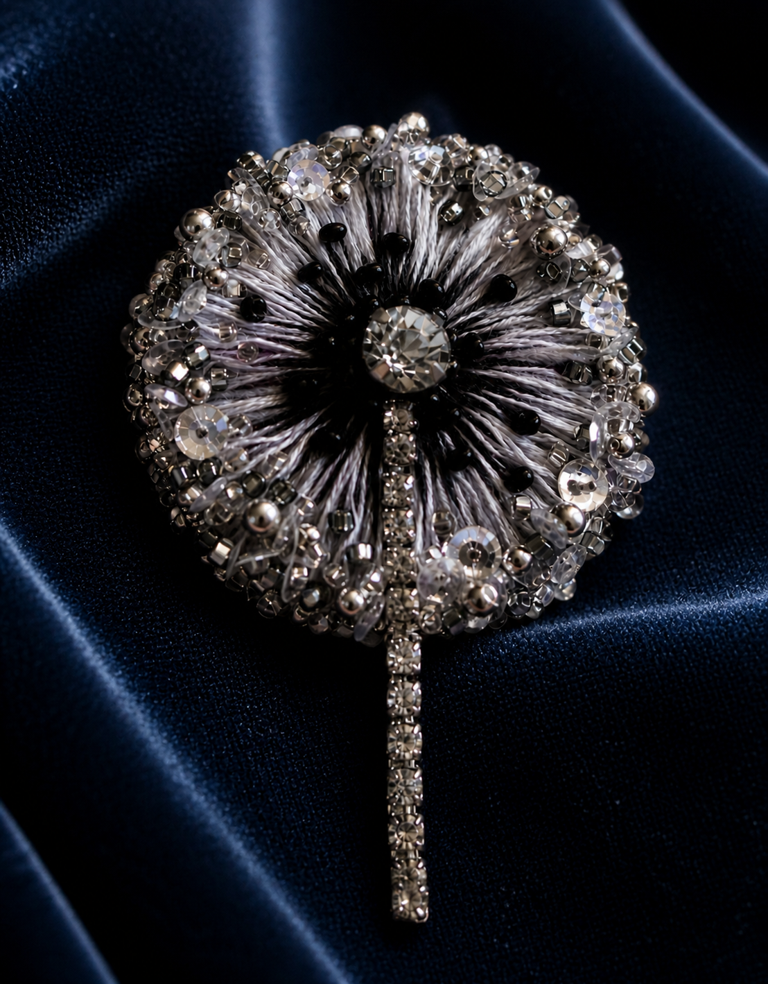 Dandelion Light brooch in Argent Lune on dark silk